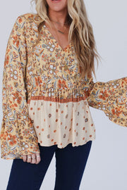 Peplum Printed Surplice Flare Sleeve Blouse